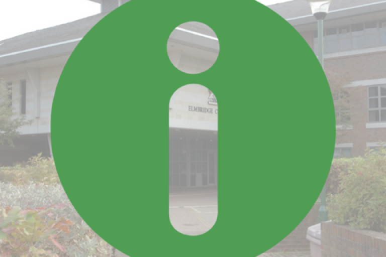 Information symbol with Elmbridge civic centre in background