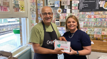 Al, owner of Cafe Noir, and Cllr Hewens presenting the Love Elmbridge Award.